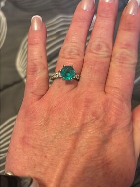 Vibrant Green Solitaire Ring with three carat Moissanite. GRA Certified size 7